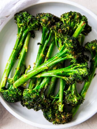 roasted broccolini on white plate