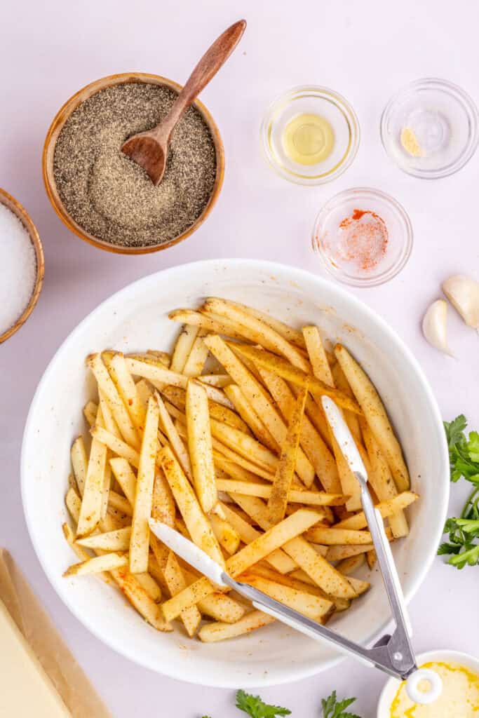 Toss with tongs until fully the potatoes are fully coated.