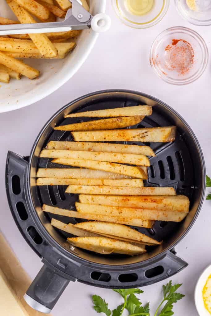 Lay the potatoes evenly in the air fryer tray so they do not overlap. Cook in the air fryer at 400° F for 10 minutes. Shake and flip them around and cook the other side for an additional 10 minutes or until golden and crisp. 