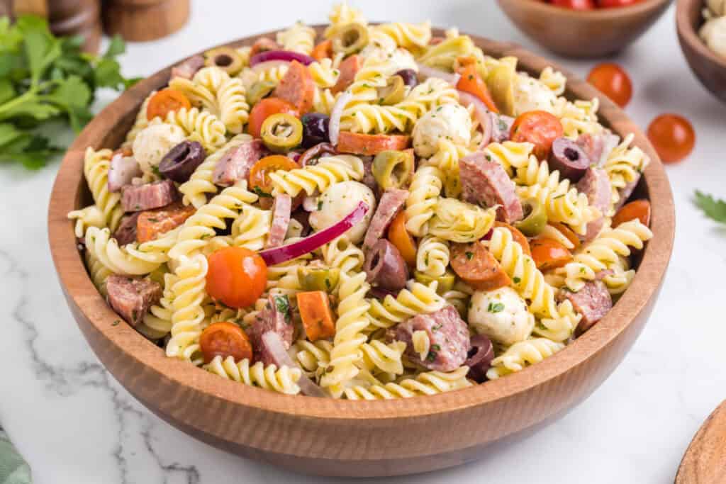 italian pasta salad in wooden bowl