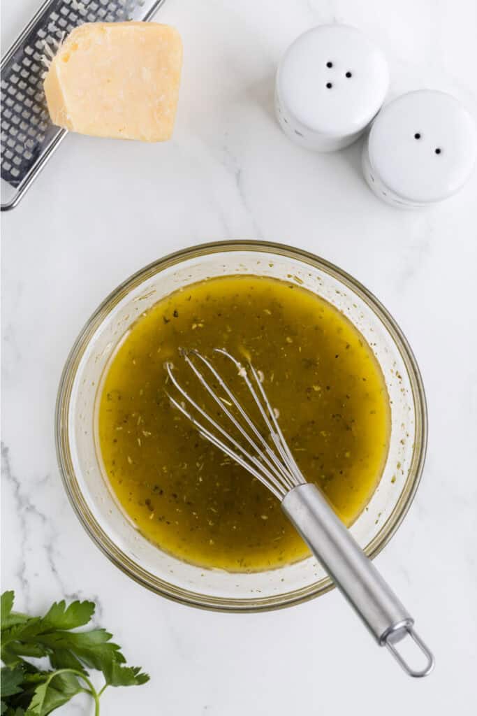 In a small bowl, whisk together the dressing ingredients. Season with salt and pepper to taste and set aside.