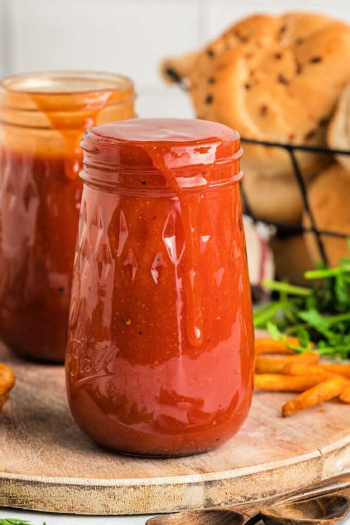 glass jar overflowing with sauce