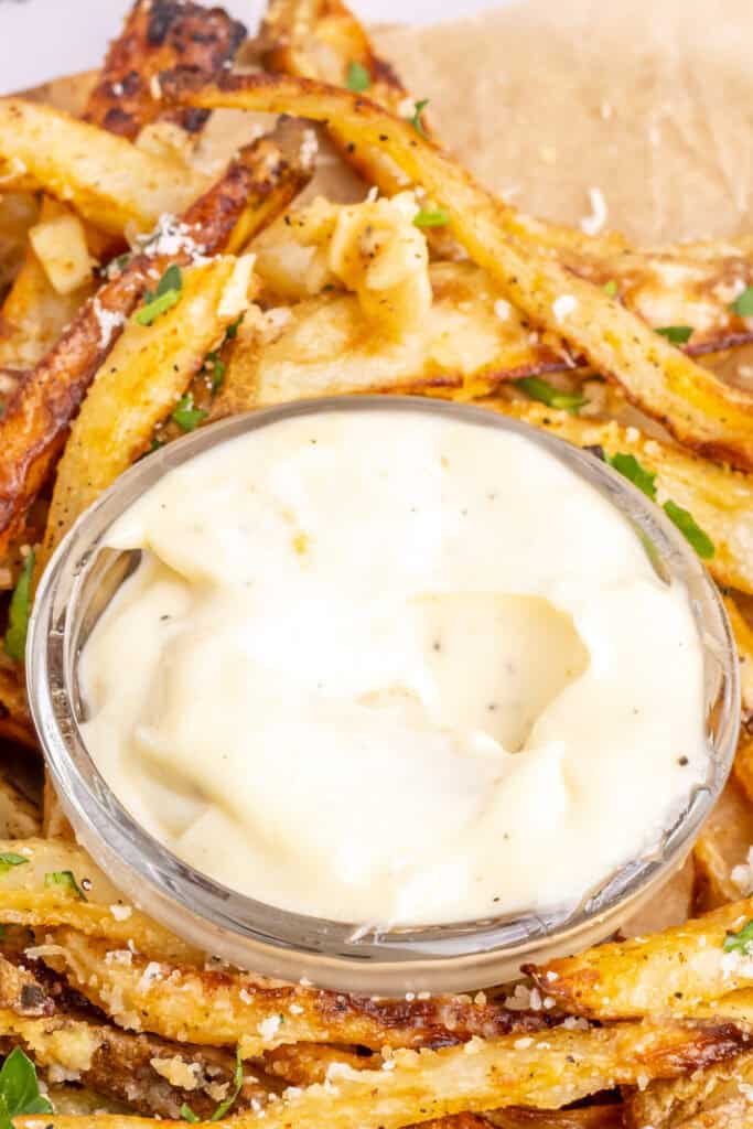 closeup of a bowl filled with garlic aioli