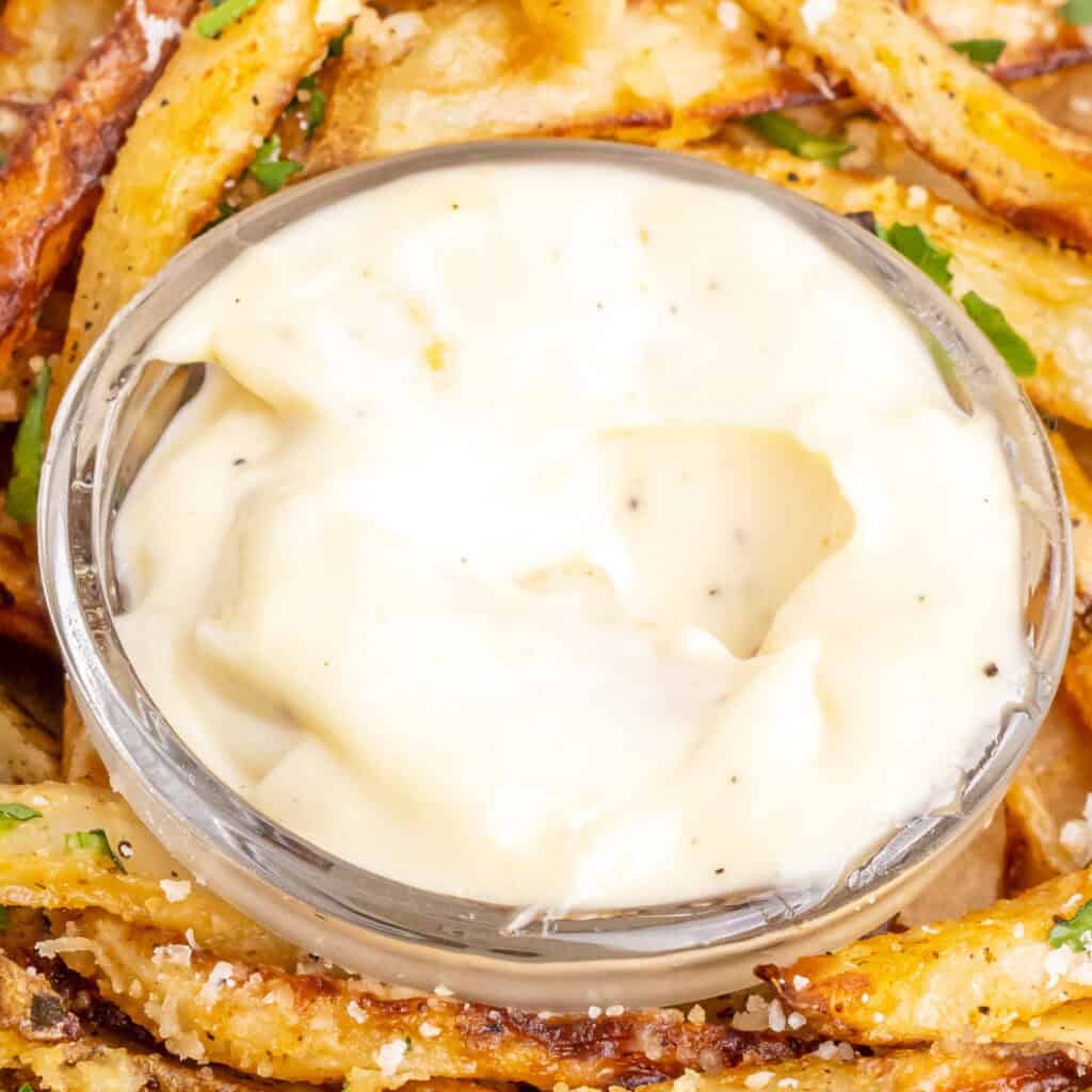 closeup of homemade garlic aioli in small bowl