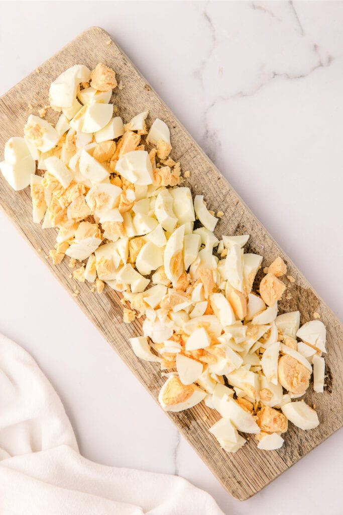 chopped eggs on cutting board