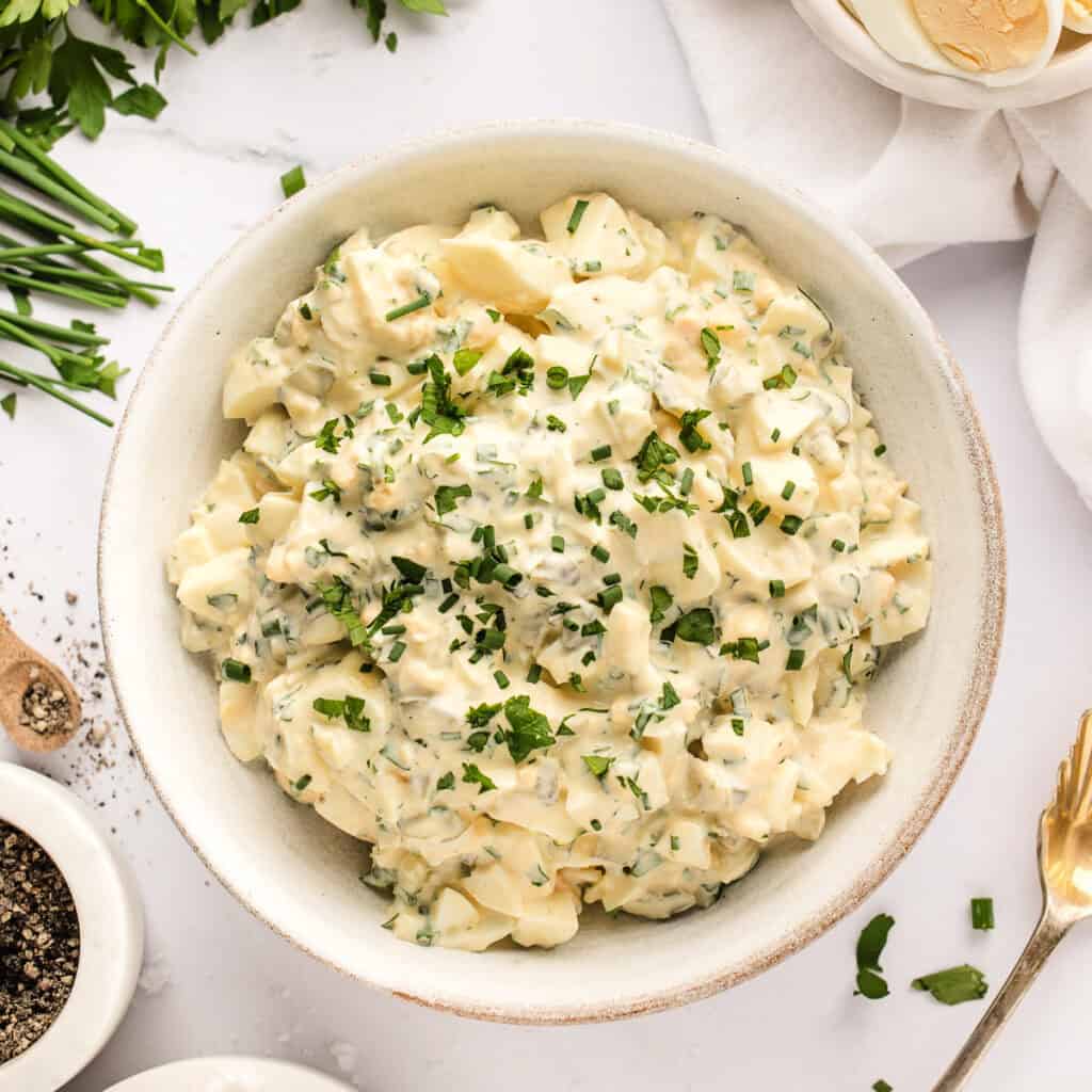 closeup of herbed egg salad in bowl