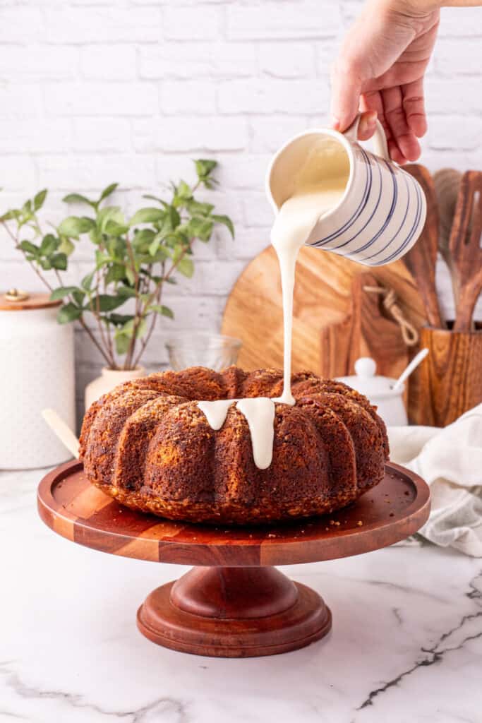 finished Hummingbird Bundt Cake being glazed