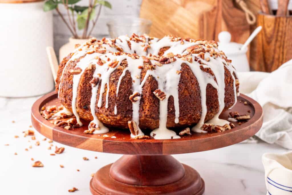 hummingbird bundt cake on wooden cake stand