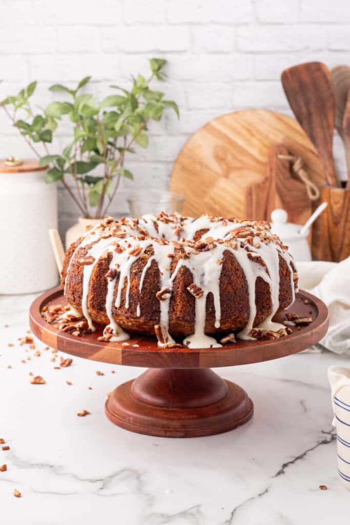 hummingbird bundt cake on wooden cake stand