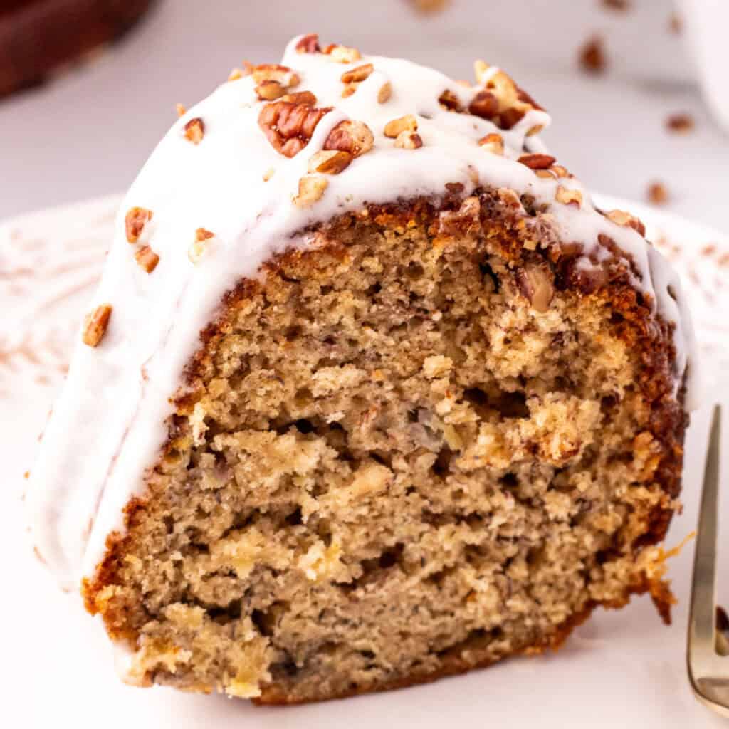 closeup of a slice of hummingbird bundt cake on plate