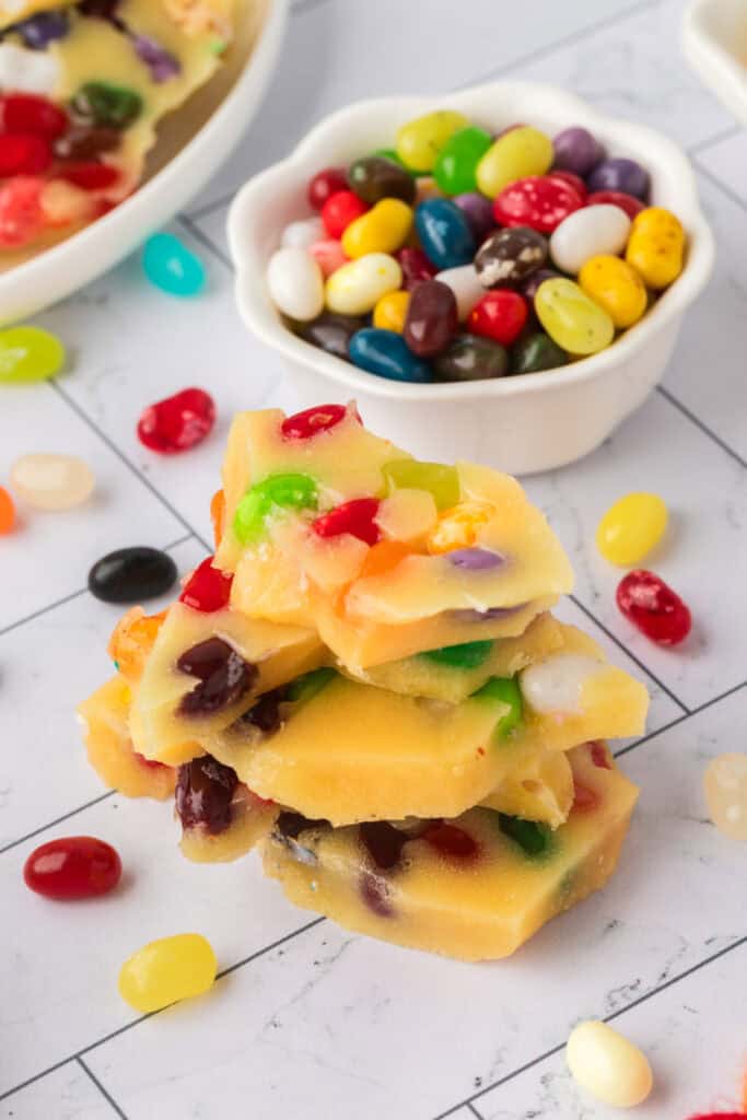 pieces of jelly bean brittle stacked on top of each other