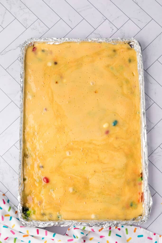 the candy mixture poured over the jelly bean to harden