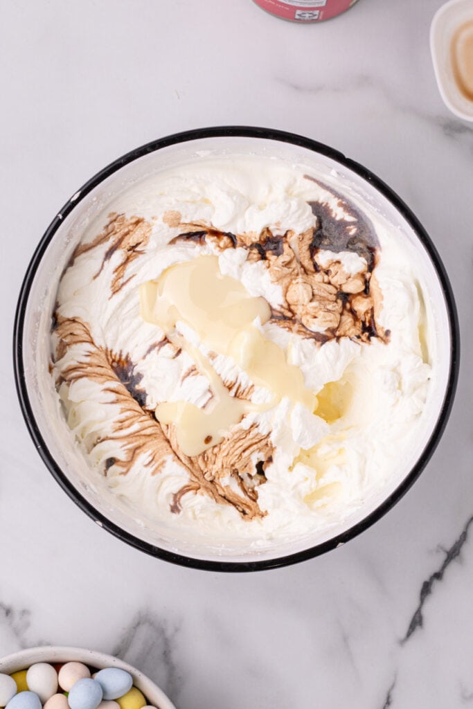 vanilla and sweetened condensed milk added to the whipped cream
