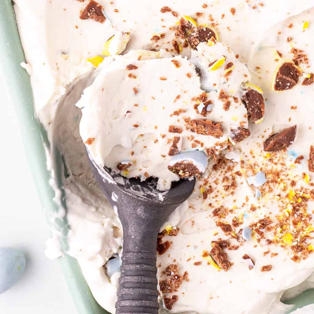 closeup of easter ice cream being scooped from the container