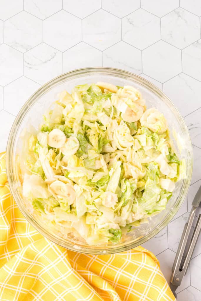 lettuce salad with bananas and dressing mixed in