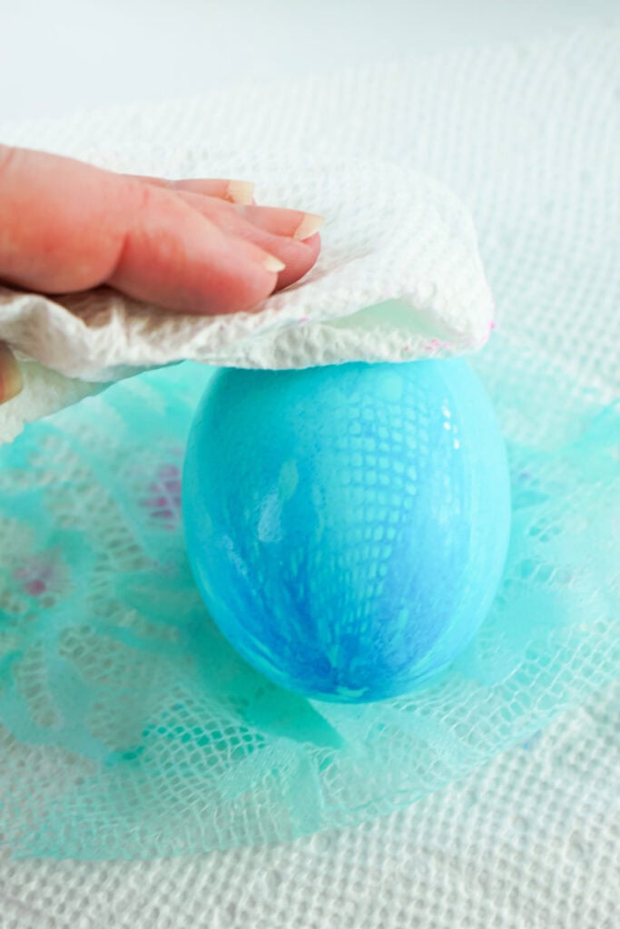 patting the fabric textured easter egg dry