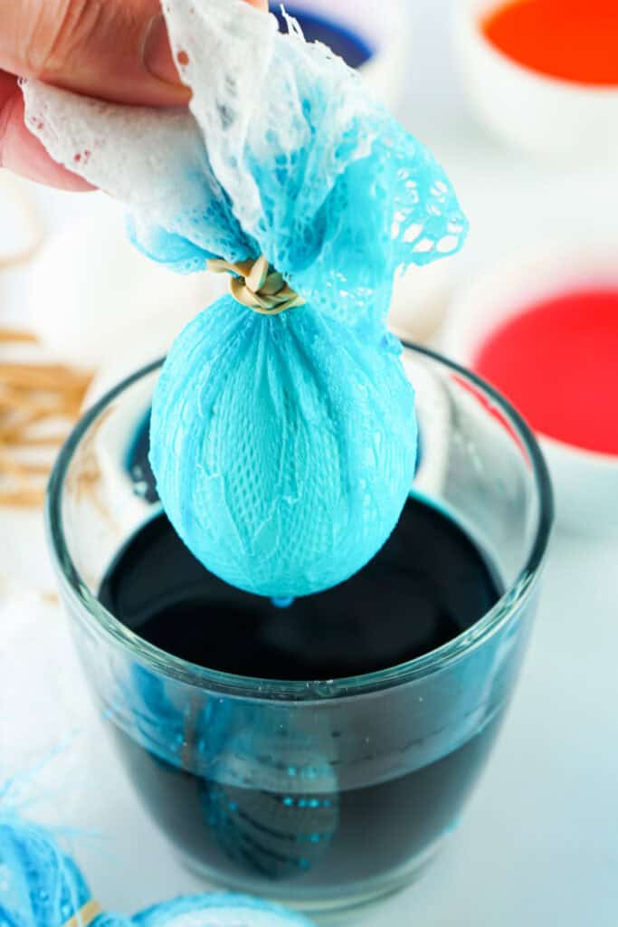 lace wrapped easter egg after being dipped in dye