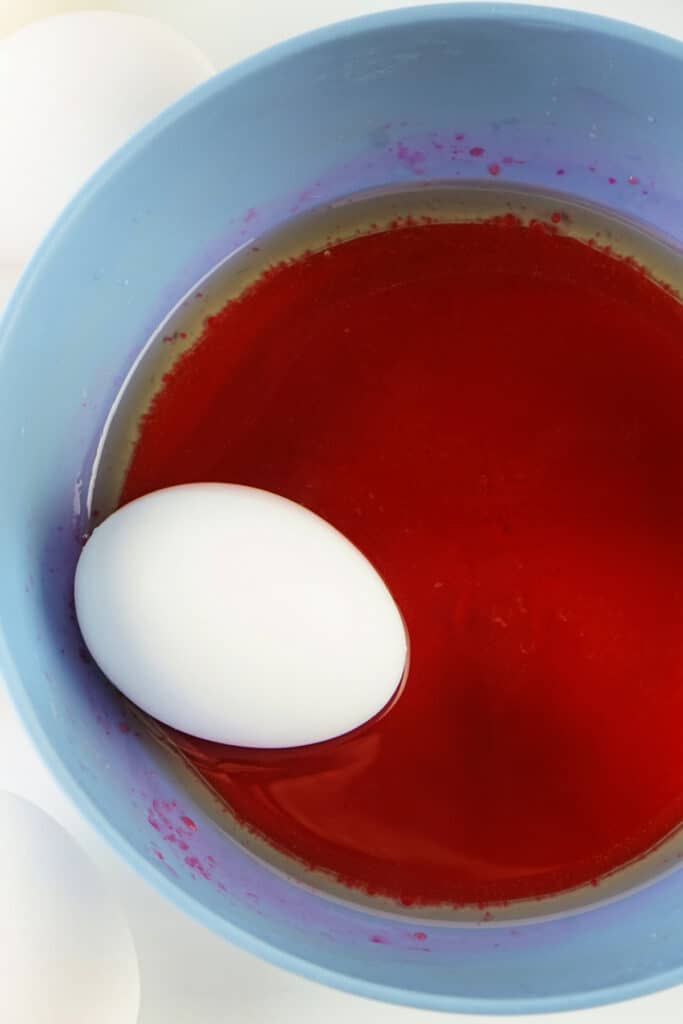 egg sitting in the water mixture