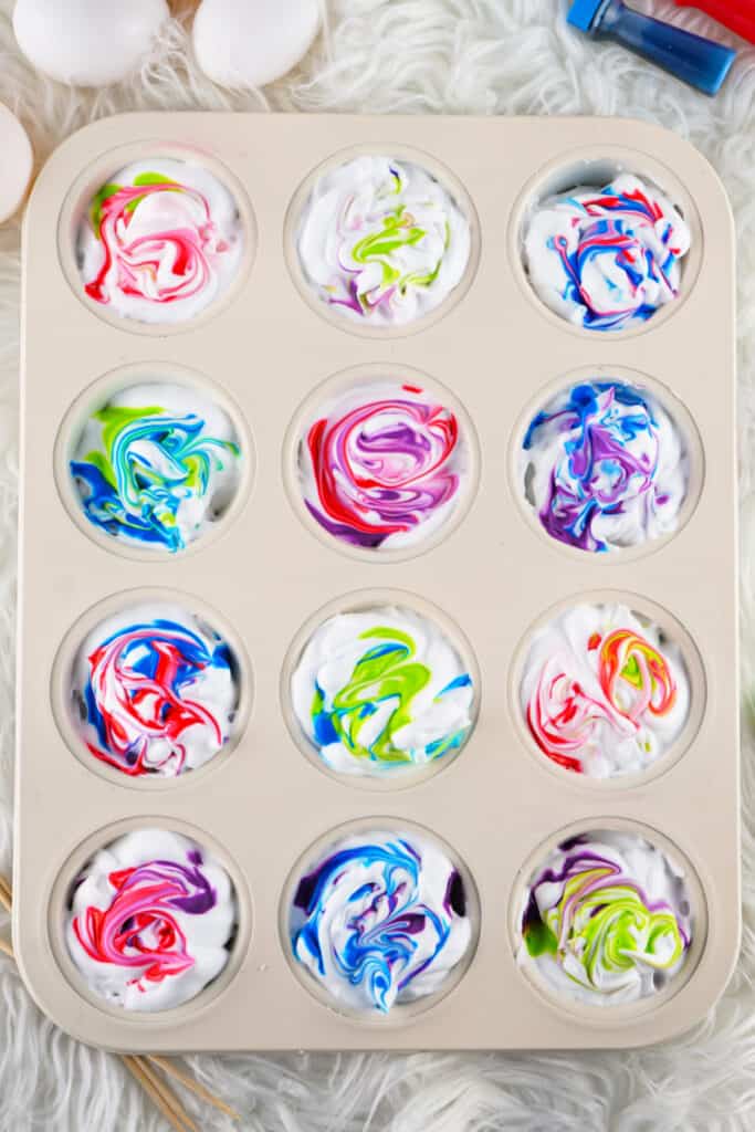colored dyes swirled in the shaving cream