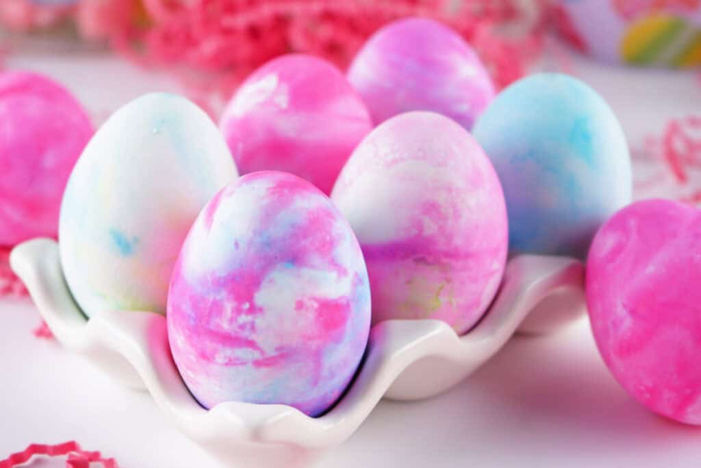 shaving cream dyed easter eggs in egg carton holder
