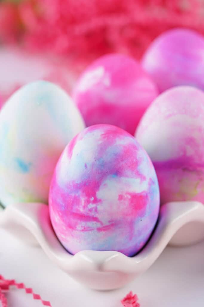 closeup of shaving cream easter eggs in carton