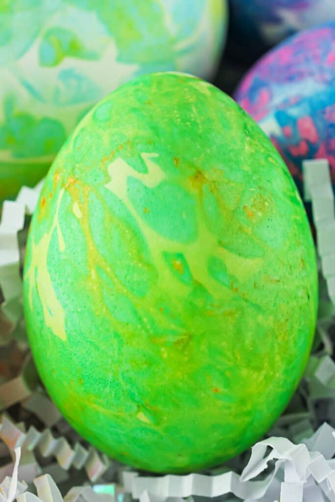 closeup of a green tissue paper dyed easter egg