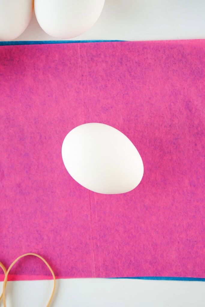 egg placed on sheets of tissue paper