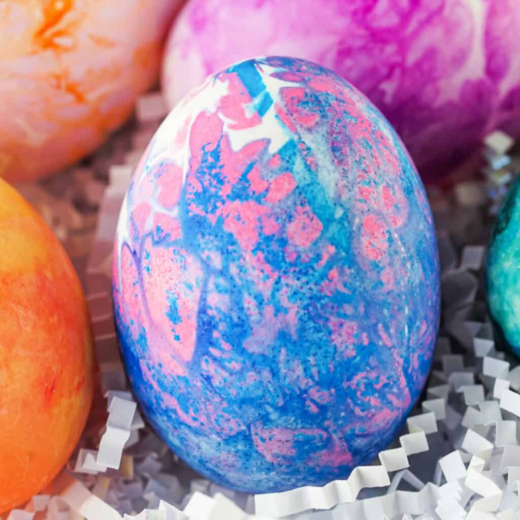 pink and blue tissue paper dyed easter egg