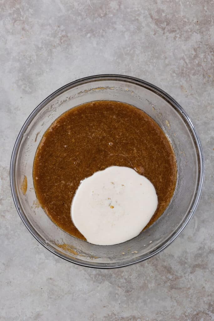 Sourdough discard added to the wet batter in the mixing bowl.