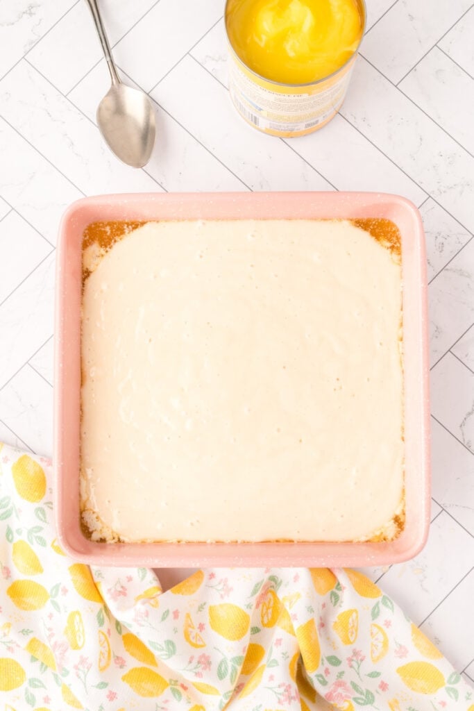 Batter poured over the melted butter in the baking dish before adding filling