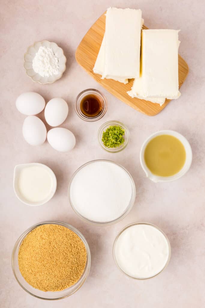 Overhead shot of all Key Lime Cheesecake ingredients arranged on a counter