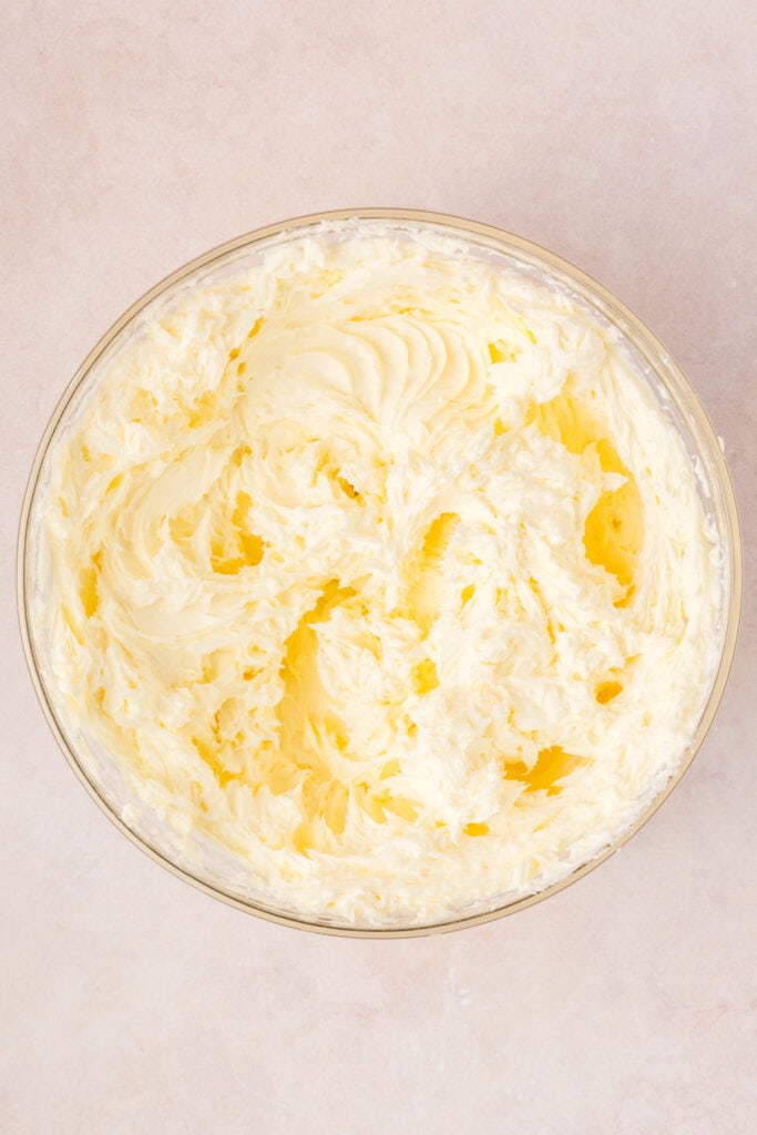 Bowl of whipped cream cheese and sugar mixture for the cheesecake filling