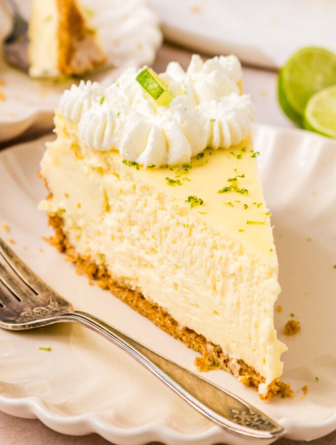 closeup of a slice of key lime cheesecake on plate