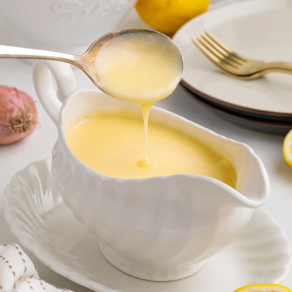 closeup lemon butter sauce in serving dish