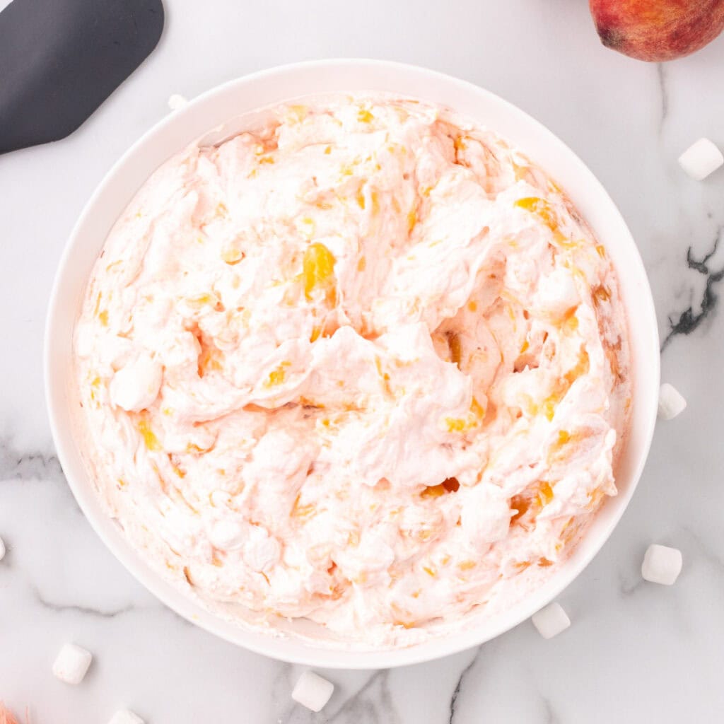 closeup of peach fluff salad in bowl