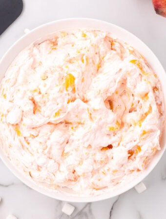 closeup of peach fluff salad in bowl
