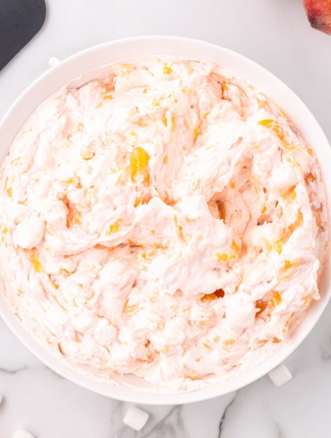 closeup of peach fluff salad in bowl