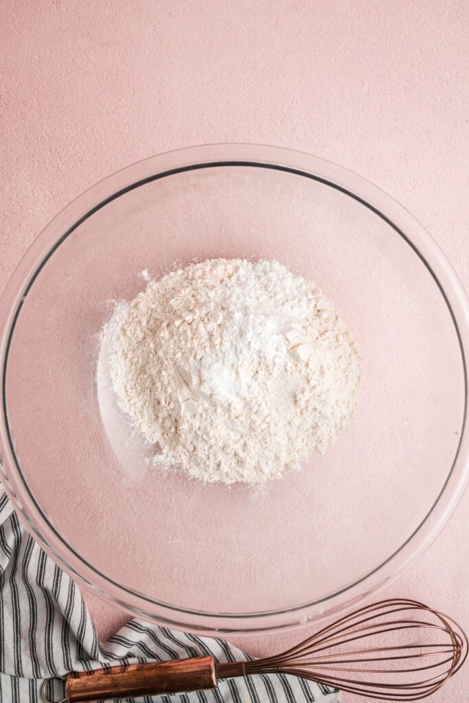Dry ingredients including flour, baking powder, and salt in a large bowl