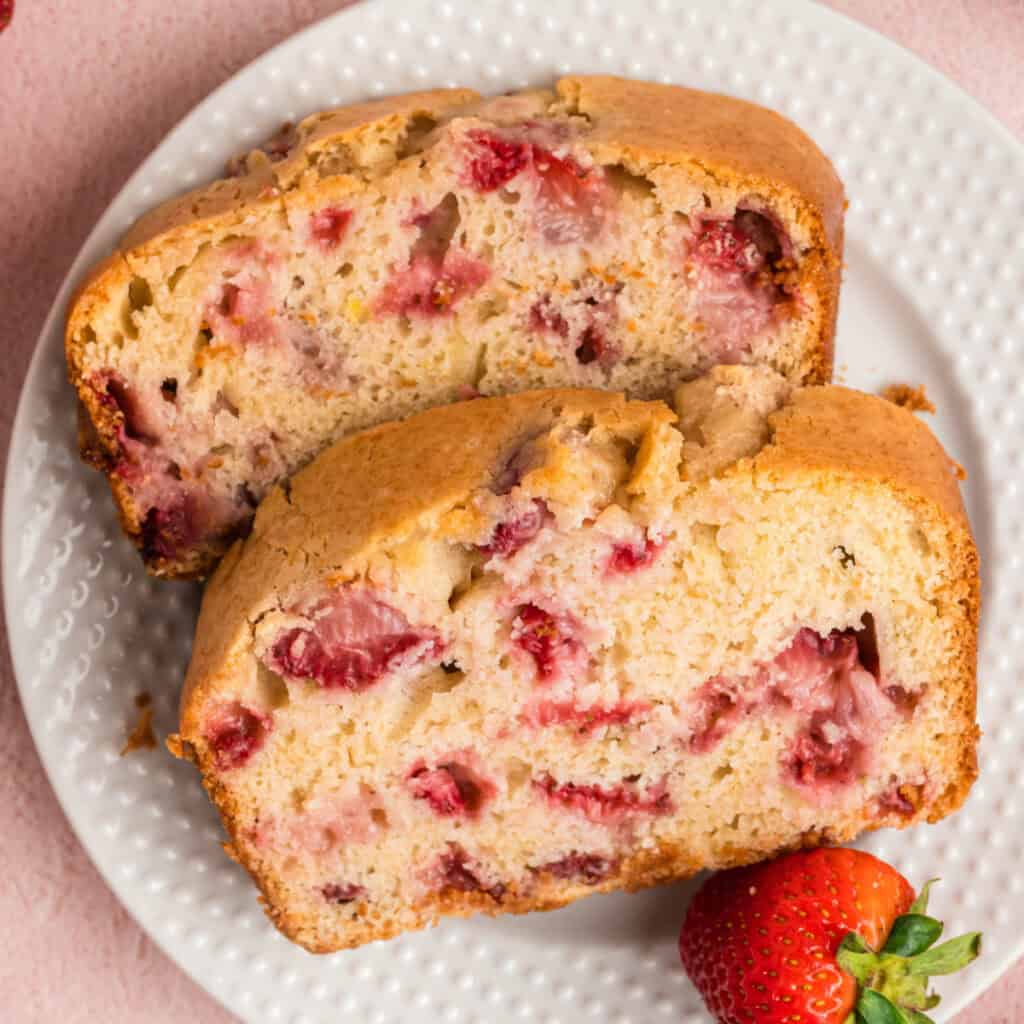 closeup of two slices of strawberry bread on a plate
