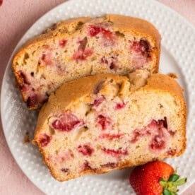 closeup of two slices of strawberry bread on a plate