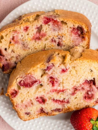 closeup of two slices of strawberry bread on a plate