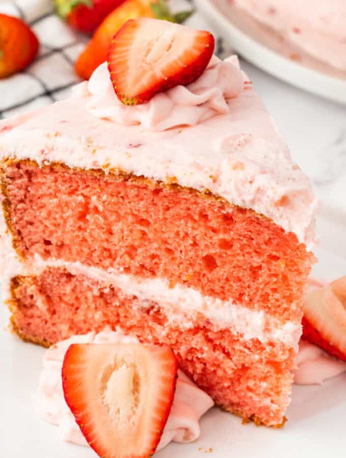 closeup of a slice of strawberry cake on plate