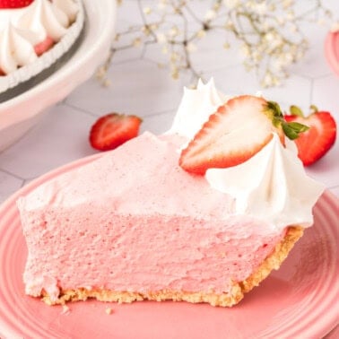 closeup of a slice of strawberry jello cream pie on a plate