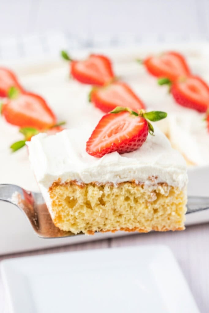 slice of three milk cake on spatula to serve