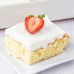 closeup of a slice of tres leches cake on plate