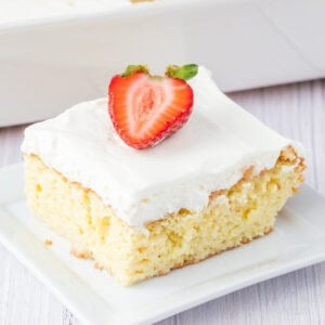 closeup of a slice of tres leches cake on plate