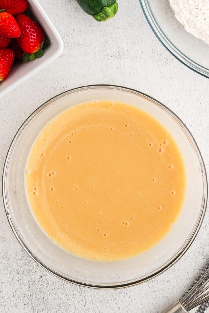 Wet mixture fully combined with sugars into a smooth batter