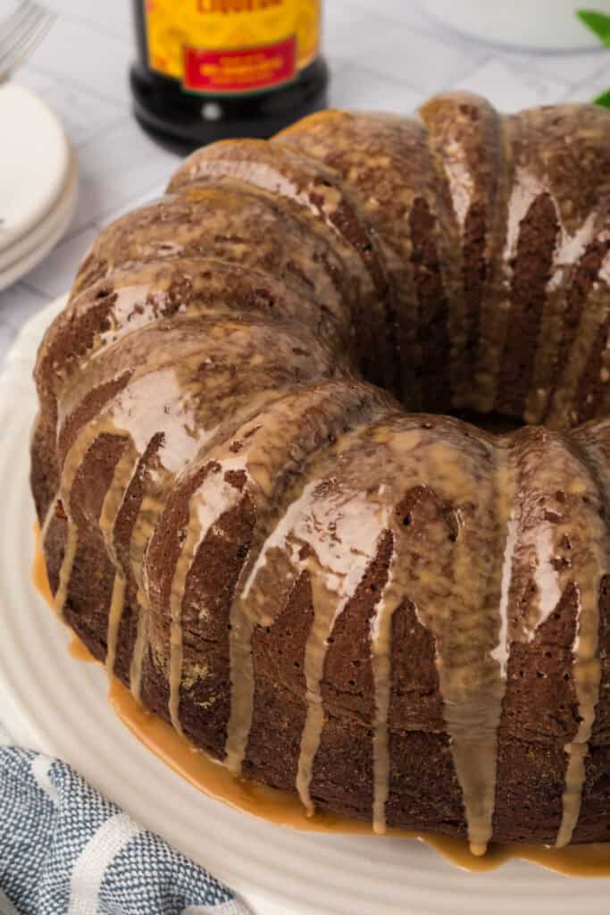 Close-up of the Chocolate Kahlua Bundt Cake with thick glaze drizzling down the sides.