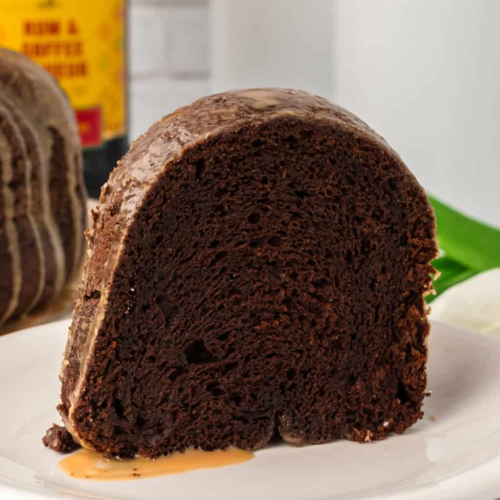 Close-up of a single slice of Chocolate Kahlua Bundt Cake on a white plate.