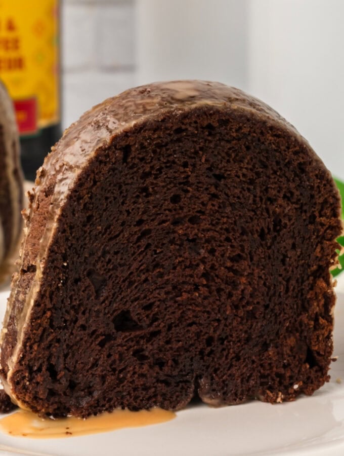 Close-up of a single slice of Chocolate Kahlua Bundt Cake on a white plate.
